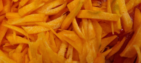 Detailed view of a pile of freshly cooked french fries, perfect for food backgroundsの写真素材