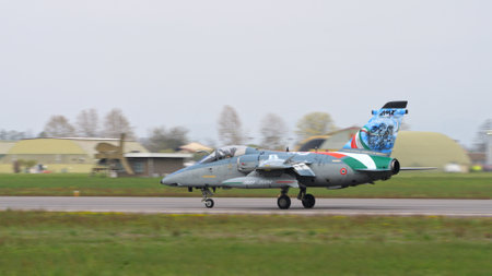 Istrana Italy April 5 2024: Fighter Jet Taxiing on Military Airport Runway. AMX Ghibli of Italian Air Force. Copy Spaceのeditorial素材
