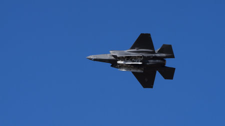 Athens Greece September 3 2023: Combat aircraft flying with open weapon bays against clear blue sky. Lockheed Martin F-35 Lightning II of United States Air Force. Copy Space.のeditorial素材