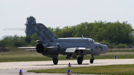 Zagreb Croatia May 11 2024: Soviet-era combat aircraft MiG-21 Fishbed on runway, rear view. Copy Space. Mikoyan Gurevich MiG-21 Fishbed of Croatian Air Force.のeditorial素材