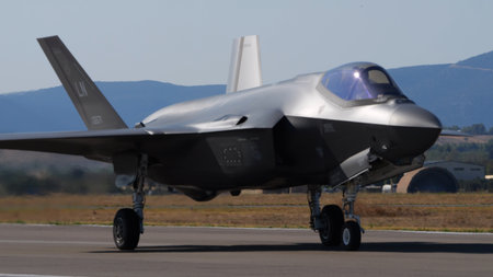 Athens Greece September 3 2023: Fighter jet taxiing on the runway with mountain in the background....