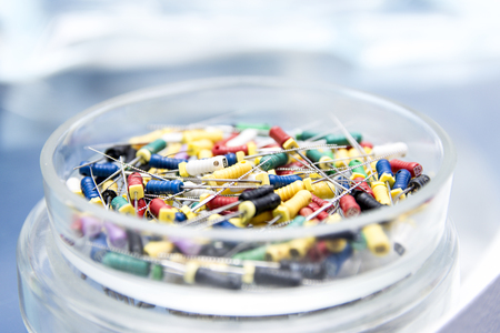 Dental tools in the glass round box. Dental instruments - k-files. Close-up dentist tools capture.の写真素材