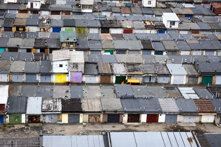Aerial view of many garages for parking cars in sleeping district of the city. aerial panoramic view.の写真素材
