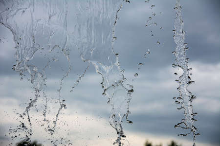 waterfall against the sky. the falling water is frozen in the picture. cool shot of water splashes....