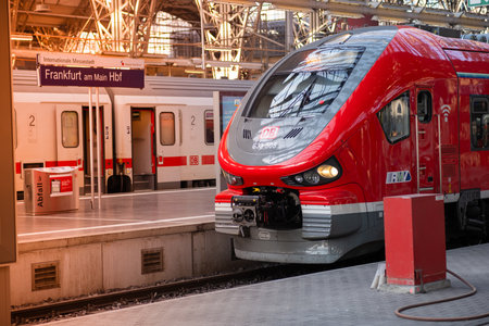Frankfurt AM, Germany - 06.13.2023: Red modern Deutsche Bahn train at the station. Beautiful train close-up.のeditorial素材