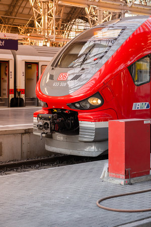 Frankfurt AM, Germany - 06.13.2023: Red modern Deutsche Bahn train at the station. Beautiful train close-up.のeditorial素材