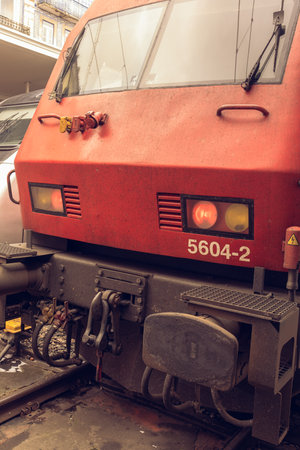 Red locomotive with burning red lights. Locomotive, front view. Detailed view of the front of the train.の写真素材