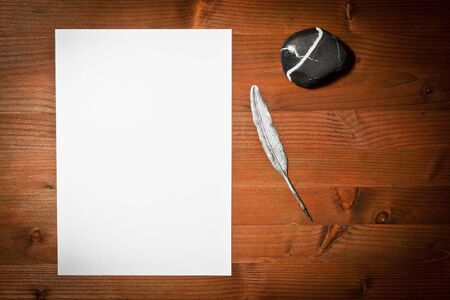 paper white and ancient pen on wood の写真素材