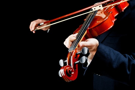 particularly of the hands of the violinist, playing the notesの写真素材