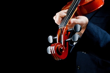 particularly of the hands of the violinist, playing the notesの写真素材