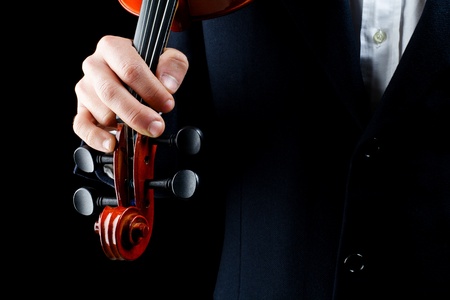 particularly of the hands of the violinist, playing the notesの写真素材