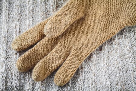 glove on wool sweater の写真素材