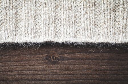 wool sweater on wood の写真素材