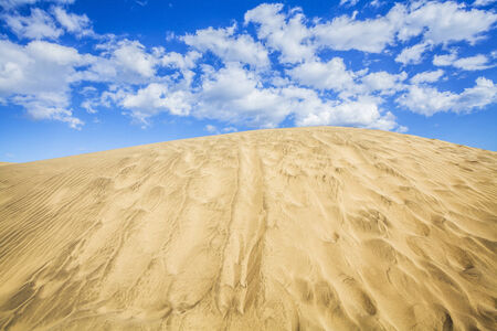 sand dunes and sky in maspalomas gran canariaの写真素材