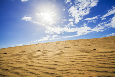 sand dunes and sky in maspalomas gran canariaの写真素材