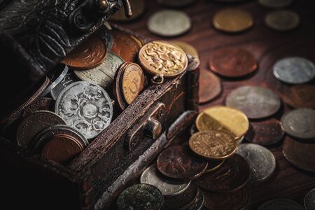 old coins in chestの写真素材