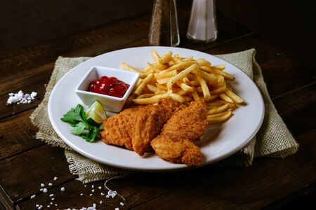 chicken fingers with french fries and ketchup