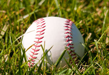 Image of a baseball on grassの写真素材