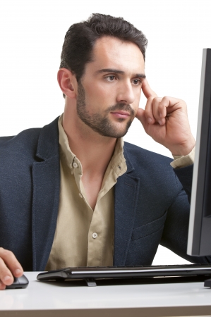 Man looking at a computer screen, thinking about the job at handの写真素材
