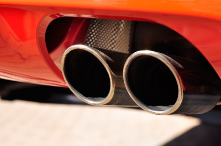 Close up of a red car dual exhaust pipeの写真素材