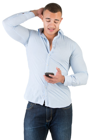 Young man using a smartphone and looking worriedの写真素材