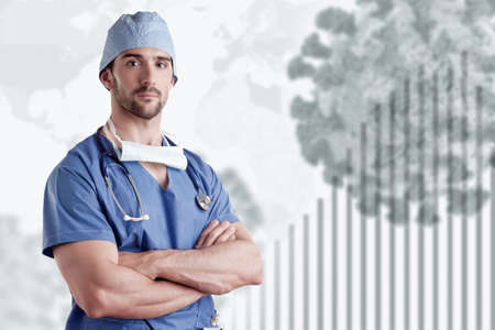 Young male surgeon with scrubs during the Coronavirus pandemicの写真素材