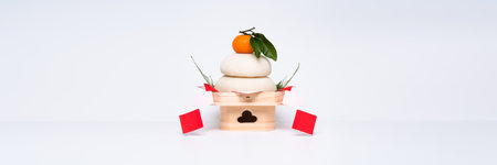 "Kagamimochi" is an offering to the gods."Kagamimochi" is placed in the center of a white background.Low pedestal. Using rice cakes made of ceramic.の写真素材
