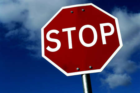 street stop sign with clouds and sky as backgroundの写真素材