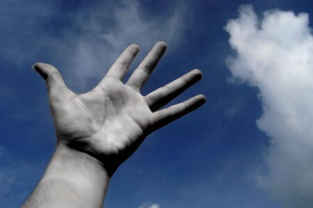 open hand in black and white and the blue sky