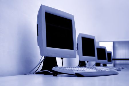 blue computer room detail with some monitorsの写真素材