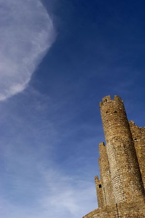 portuguese ancient castle with a big cloud in the skyの写真素材