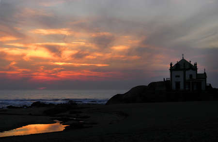 church in the beach at sunsetの写真素材