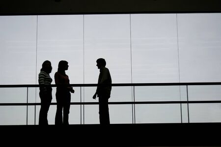 group talking in the buildingの写真素材