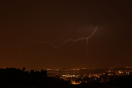 thunder at night over a city in portugal