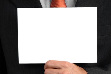 business man holding a card in his chestの写真素材