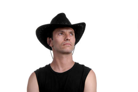 young man portrait with hat cowboy isolatedの写真素材