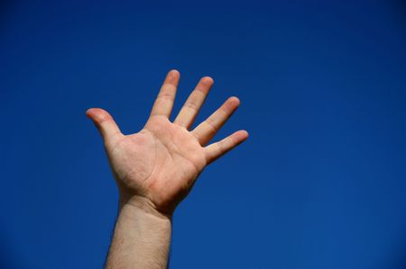 human male hand with the sky as backgroundの写真素材