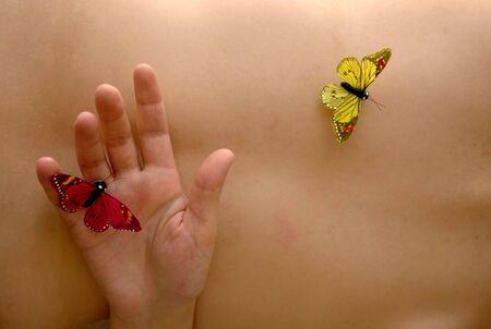 fake butterflys in woman naked skin detailの写真素材