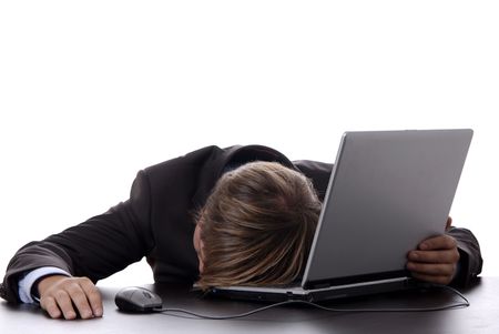 young business man sleeping on the laptopの写真素材