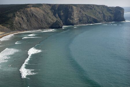 Beach, surfers from above, in the south of portugalの写真素材