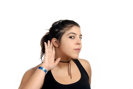 young woman with open hand, earing somethingの写真素材