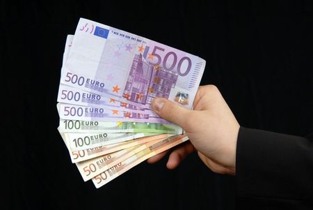 detail of man hand with lots of money 
