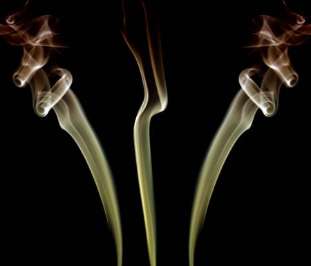 abstract colored smoke on a black backgroundの写真素材