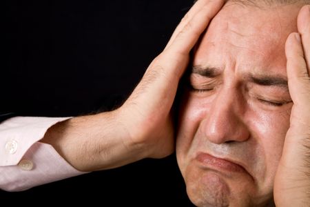 sad mature business man on a black background
