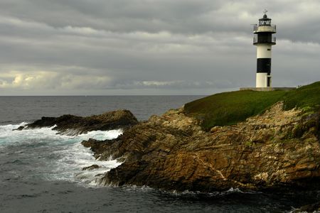 small lighthouse at the coast of north of spain                               の写真素材