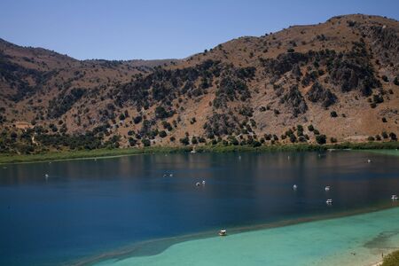famous kournas lake at the mountains in the greek island of creteの写真素材