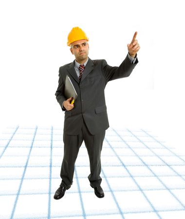 An engineer with yellow hat pointing upの写真素材