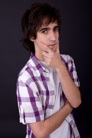 young casual man against a black backgroundの写真素材