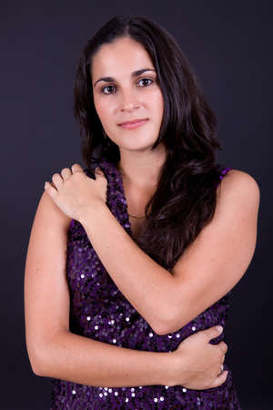 young beautiful brunette portrait against black backgroundの写真素材