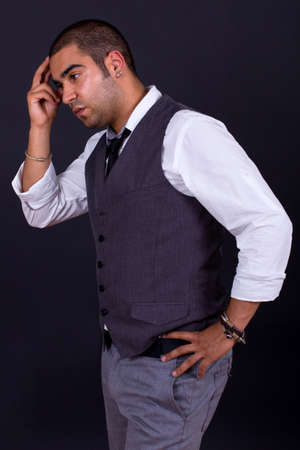 pensive business man portrait on black backgroundの写真素材